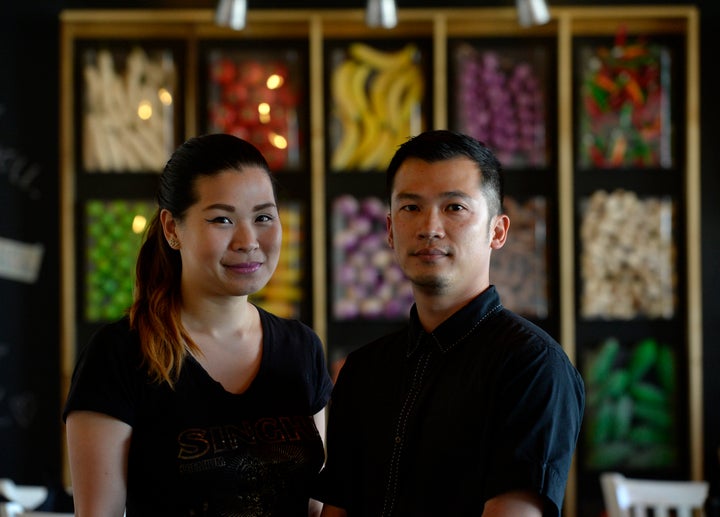 Nithiwadee Anantatho, left, and her husband, Surachai Surabotsopon, right, say a diner left a $1,000 tip at their restaurant