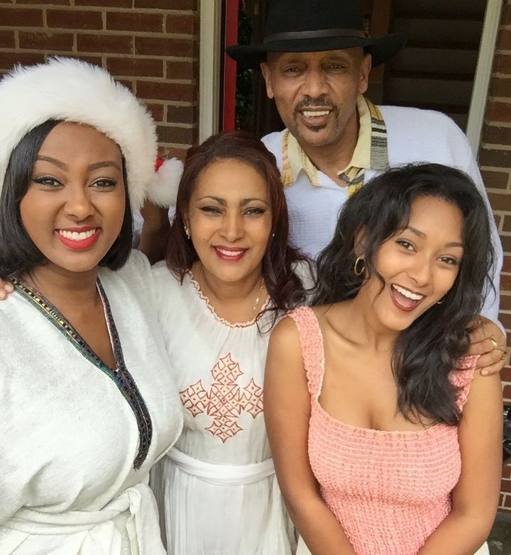 My mom, dad, sister and me decked out in our traditional Ethiopian clothing to celebrate Christmas.