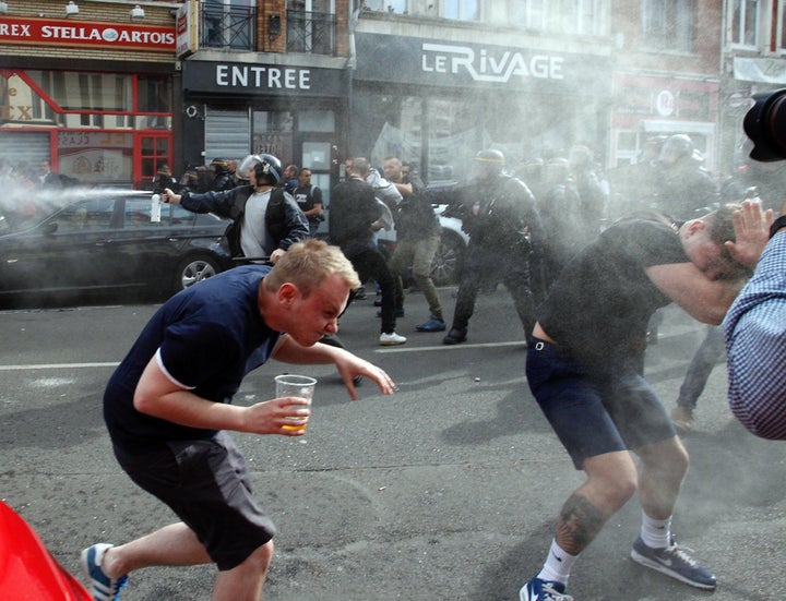 Fans have been seen being pepper-sprayed by riot police during recent clashes