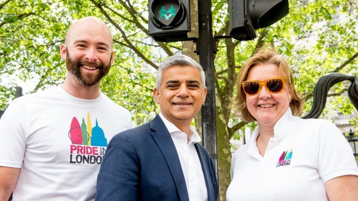 Mayor of London Sadiq Khan, center, joined Michael Salter-Church, left, and Alison Camps, right, from Pride in London to unve