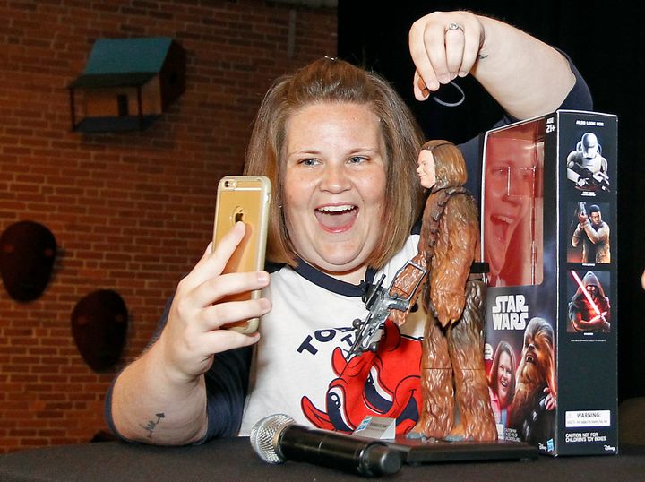 Candace Payne, also known as "Chewbacca Mom," streams a Facebook Live video with her custom Chewbacca Mom action figure on Friday.