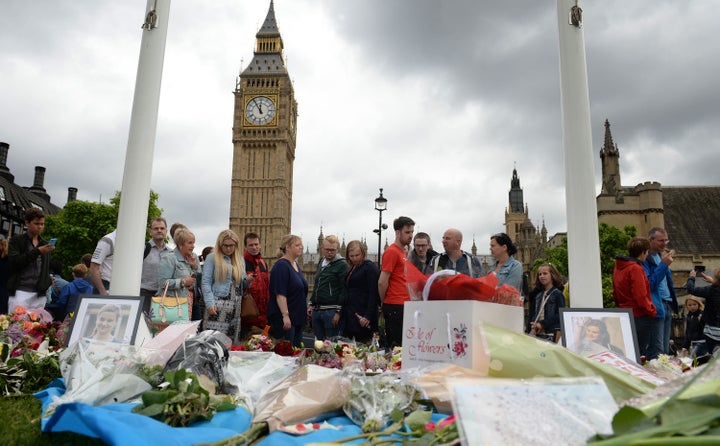 The public pay tribute outside Parliament