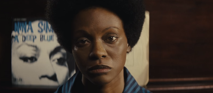 Saldana as she appeared in "Nina," with darkened skin, a prosthetic nose, and enlarged lips.