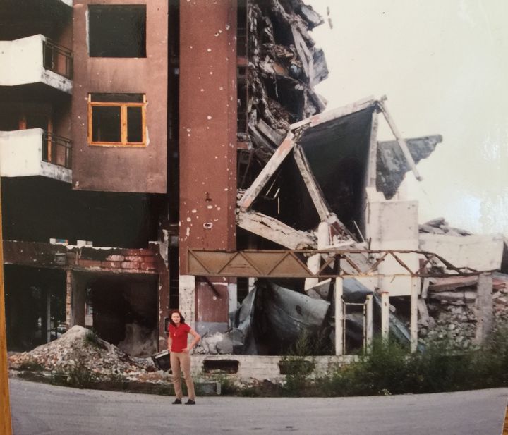 Author in front of a building, Sarajevo, 1996