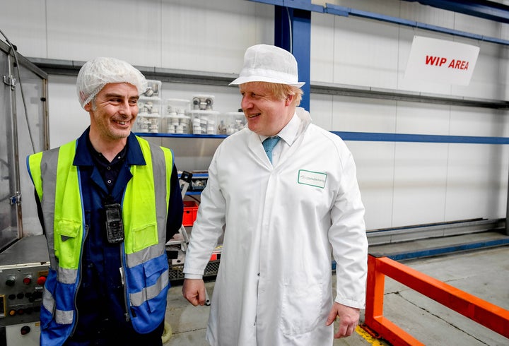 Former London Mayor Boris Johnson, right, visits a soap factory while campaigning for a Brexit. "Leave" proponents believe le