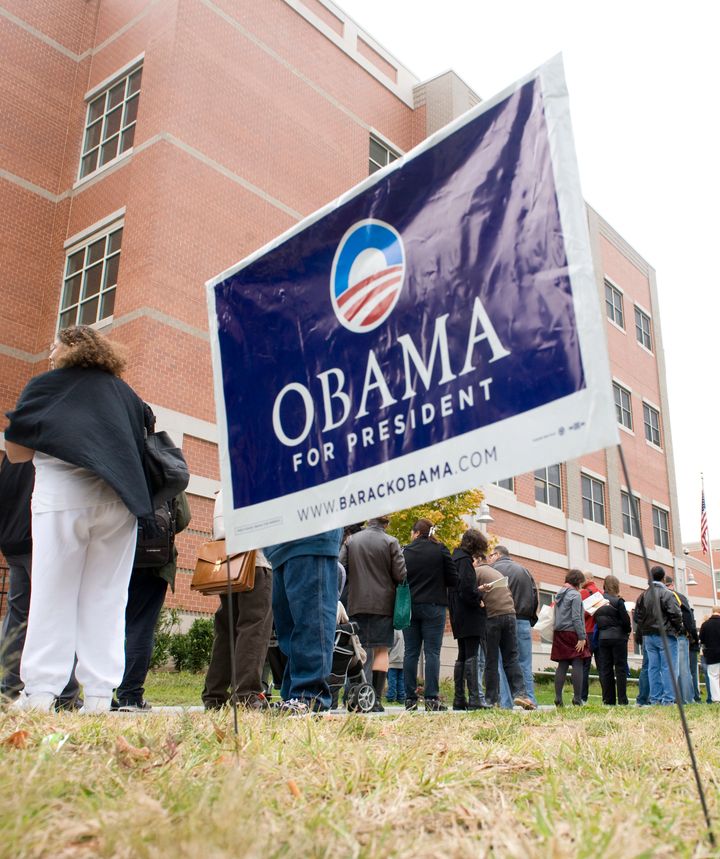 Voters wait in line to cast their ballots at the Bell Multicultural High School in the Mt. Pleasant neighborhood in Washington.