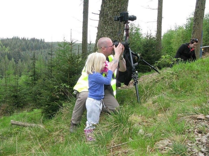 Regina, pictured here at age three, and Kevin at the mountain bike race where she first became interested in photography.