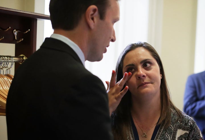 WASHINGTON, DC - JUNE 20: Erica Smegielski, daughter of slain principal Dawn Hochsprung of Sandy Hook Elementary School, is comforted by U.S. Sen. Christopher Murphy (D-CT) after votes on gun control at the Capitol June 20, 2016 in Washington, DC.