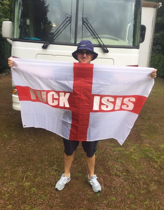 Tommy Robinson in France with his 'Fuck Isis' St George's flag