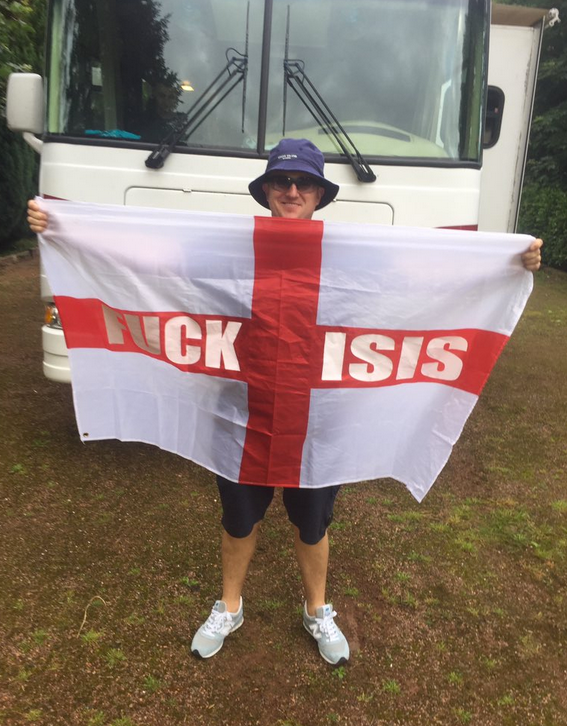 Tommy Robinson in France with his 'Fuck Isis' St George's flag