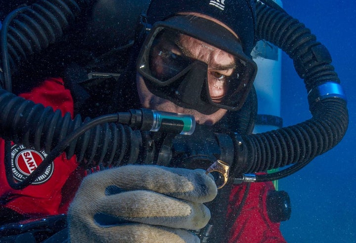 Foley recovers a gold ring from the Antikythera shipwreck.