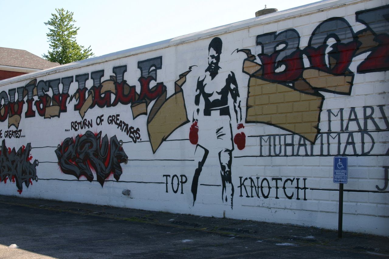 A mural of Muhammad Ali on the side of the Louisville TKO boxing gym in Louisville's Smoketown neighborhood, just blocks away from where Ali first trained as an amateur.