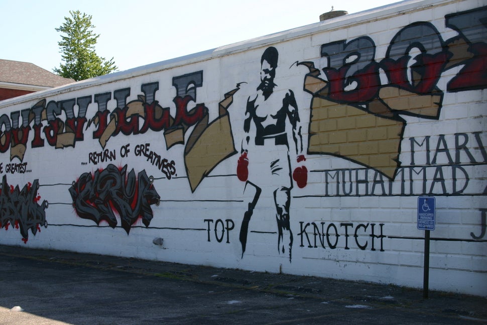 A mural of Muhammad Ali on the side of the Louisville TKO boxing gym in Louisville's Smoketown neighborhood, just blocks away
