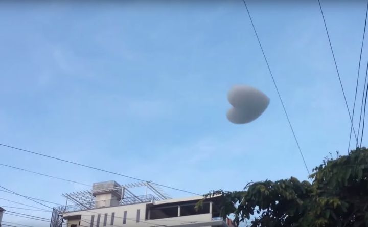 A heart-shaped "cloud," composed of soap and helium, is seen floating away after its creation.