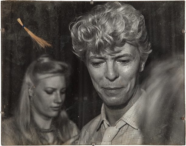 David Bowie's hair (left) and a photograph of David Bowie with Wendy Farrier in 1983. Courtesy of Heritage Auctions.