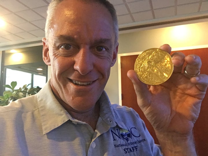 Canoeist Joe Jacobi, who won an Olympic gold medal in 1992 shows off his medal, shortly after the stolen medal was returned to him in Atlanta, Georgia.