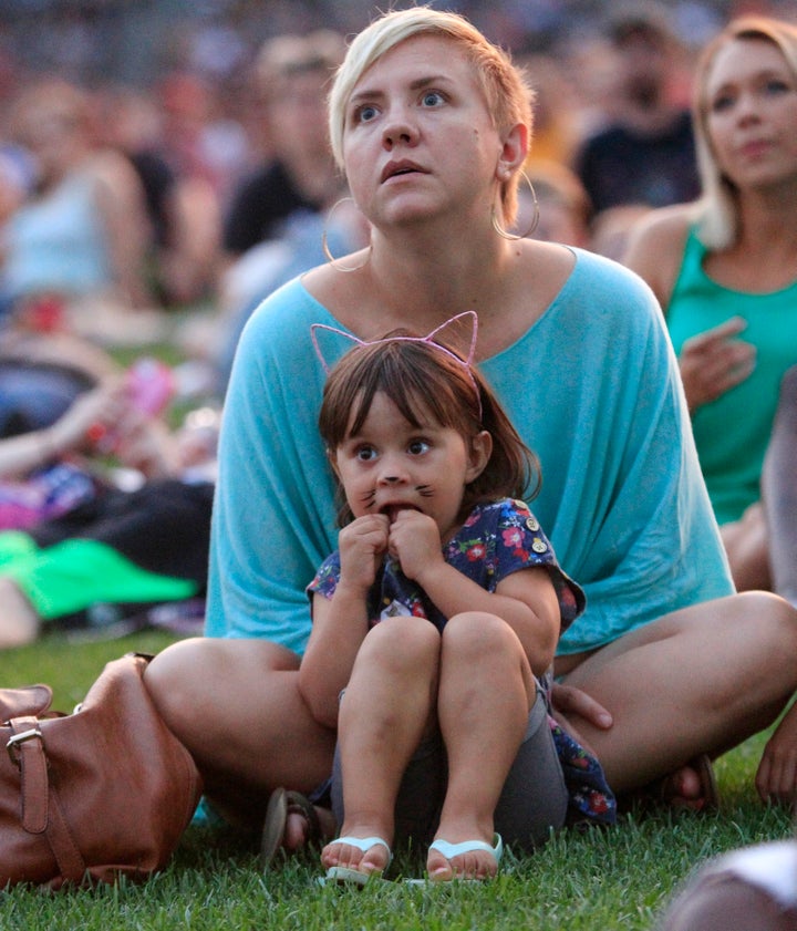 Solvei Akbar, 2, sits with her mother, Ilse Akbar, at the 4th annual Internet Cat Video Festival in 2014.