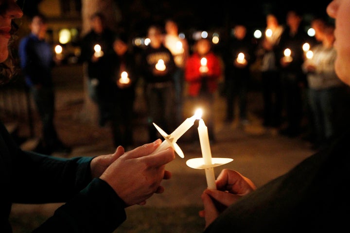 <i>Members of Queer Advocacy Network join with St. Paul’s Church of Christ Thursday evening for a candlelight vigil.&nb