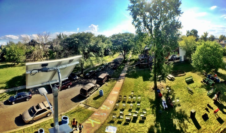 Avalon Village, seen from above, with a solar streetlight in the foreground.