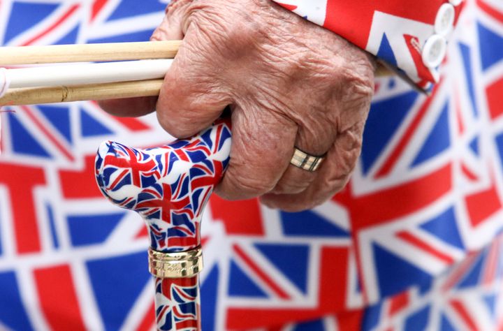 Voters who participated in the 1975 referendum have a unique perspective on the referendum vote this week. Above, a pedestrian holds a cane festooned with the British flag.