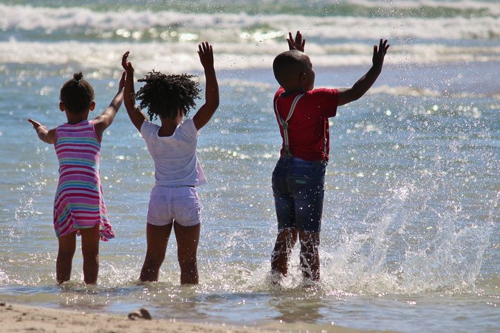 <p>Children playing at beach</p>