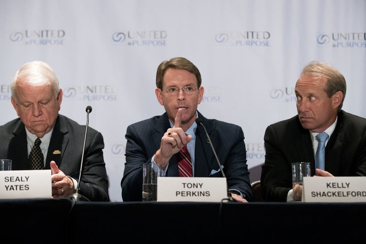 Flanked by Sealy Yates (L), founder of My Faith Votes, and Kelly Shackelford (R), president of the First Liberty Institute, Tony Perkins (C), president of the Family Research Council, speaks during a press conference following a meeting with Republican presidential candidate Donald Trump at the Marriott Marquis Hotel, June 21, 2016 in New York.