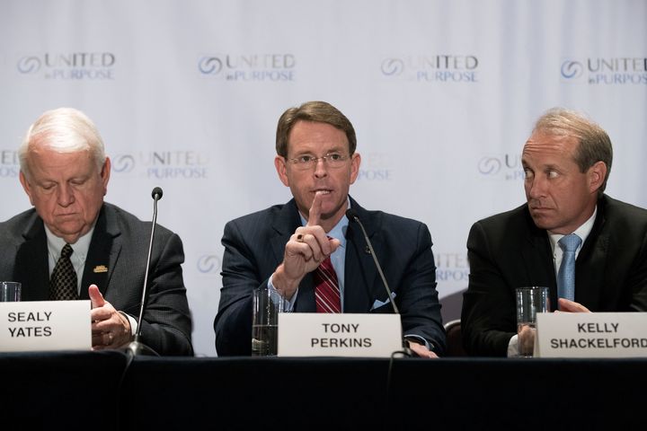 Flanked by Sealy Yates (L), founder of My Faith Votes, and Kelly Shackelford (R), president of the First Liberty Institute, Tony Perkins (C), president of the Family Research Council, speaks during a press conference following a meeting with Republican presidential candidate Donald Trump at the Marriott Marquis Hotel, June 21, 2016 in New York.
