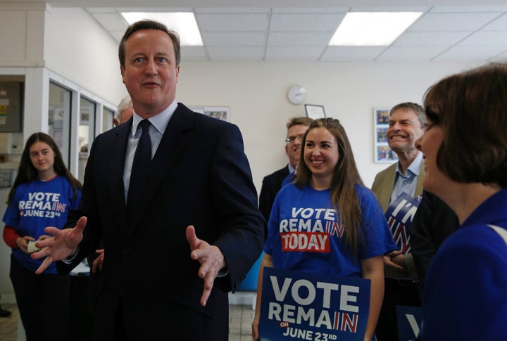 Britain's Prime Minister David Cameron speaks with campaign volunteers for the "Stronger In" campaign in on Tuesday. The