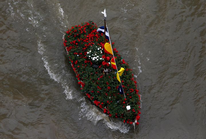 A boat filled with flowers in memory of murdered Labour Party MP Jo Cox sails down the Thames.