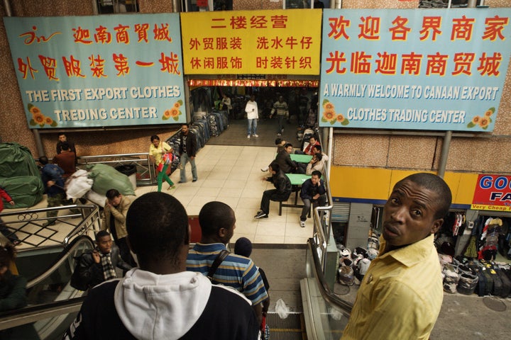 FILE PHOTO: Buyers and sellers in The Canaan Market, Guangzhou's first market catering mostly to Africans, in Guangzhou, China.