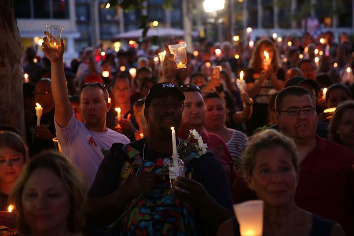 People attend a memorial service on June 19 in Orlando, Florida.