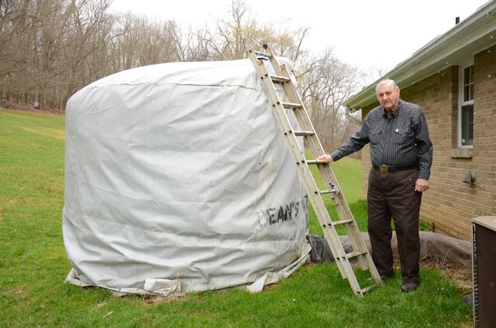 Jesse Eakin regularly monitors his 2,500-gallon “water buffalo” to make sure he’s not running low on drinkable water.