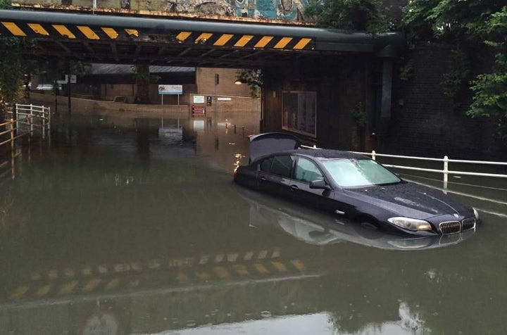 A partly submerged car in Clapham