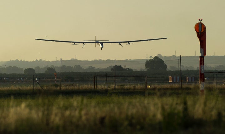 The sun-powered Solar Impulse 2 aircraft lands at Seville Airport in southwest Spain on Thursday