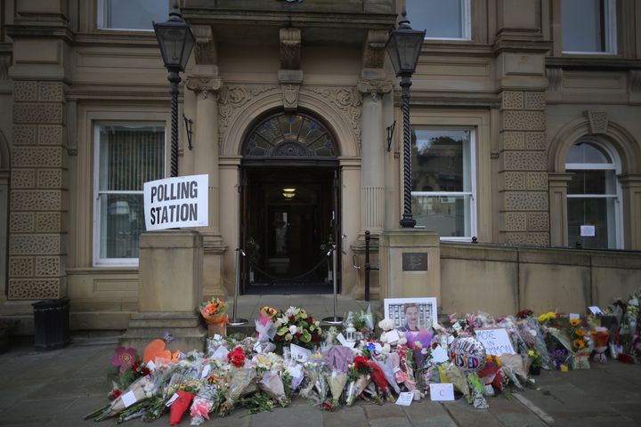 Floral tributes to slain MP Jo Cox adorn Batley Town Hall as people cast their votes in the EU referendum.