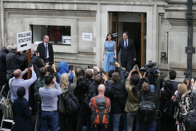David Cameron and his wife Samantha leave after casting their votes in the EU referendum at a polling...