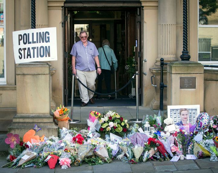 Electors walked past the tributes as they went to go and vote today