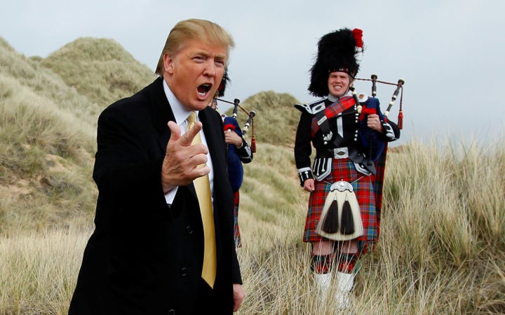 Donald Trump gestures during a media event on the sand dunes of the Menie estate, the site for Trump's proposed golf resort, near Aberdeen, Scotland, Britain May 27, 2010.