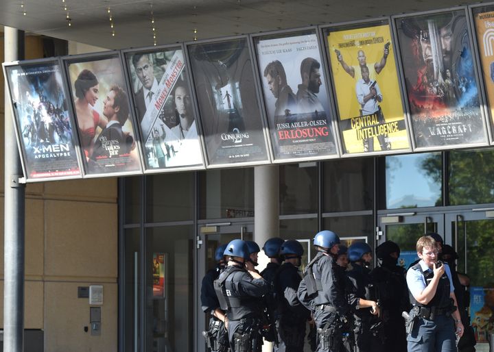 Police forces stand in front of a cinema where an armed man barricaded himself in Viernheim.