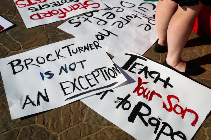 Students at Stanford carried signs in support of sexual assault survivors at commencement in 2016.