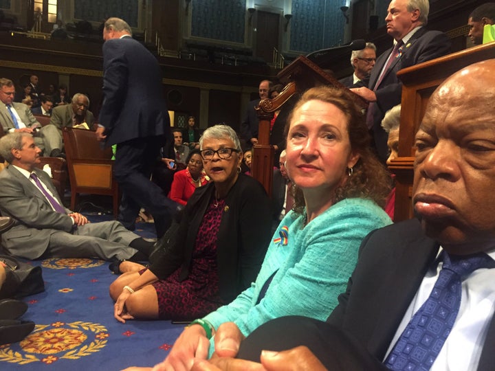 A photo shot and tweeted from the floor of the House by U.S. House Rep. David Cicilline shows Democratic members of the U.S. House of Representatives, including Rep. John Lewis (R) staging a sit-in on the House floor "to demand action on common sense gun legislation" on Capitol Hill in Washington, United States, June 22, 2016.