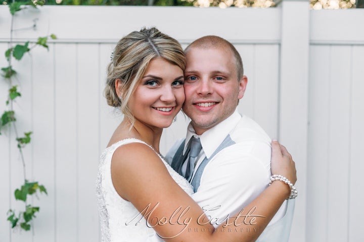 Julie and Rob first met at Rob's basketball game. "It was so cute: after every basket he made, he'd look back to see if I had seen it," Julie said. "Rob is a really shy person, so I thought it was hilarious that he was trying to impress me."