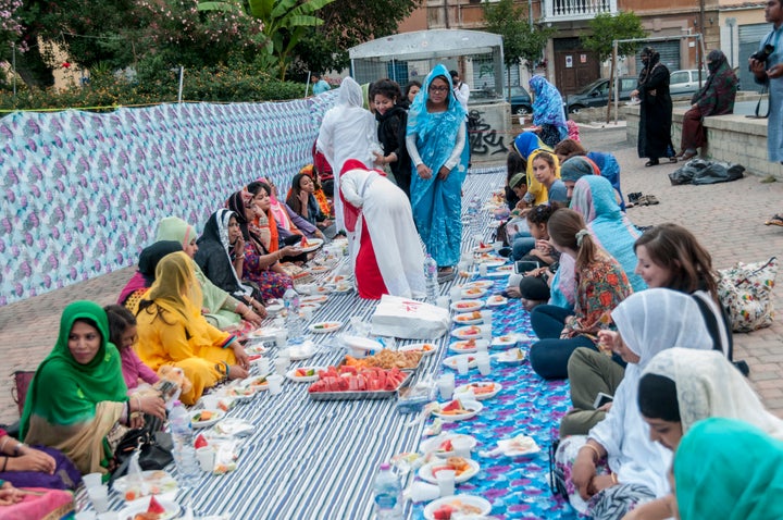 Muslims break their fast at a large community iftar in Rome, Italy.