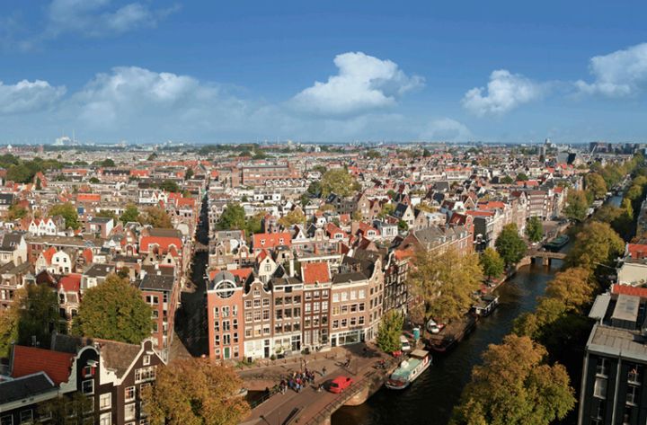 Residential and commercial neighborhoods of Amsterdam stretch as far as the eye can see along Prinsengracht, the longest of Amsterdam's four main canals.