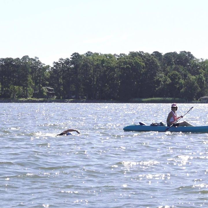 Sam Hitch swims the York River in Virginia as part of his Guinness World Record attempt for longest triathlon.