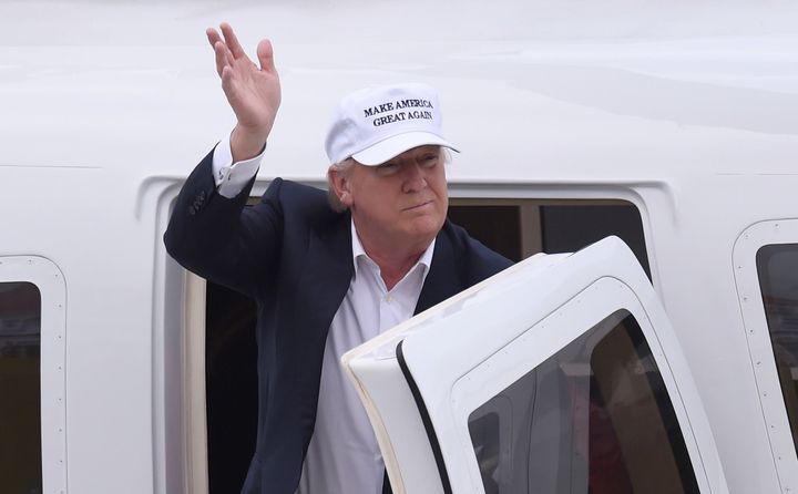 <strong>Donald Trump wore a hat with his slogan 'Make America great again' as he arrived</strong>