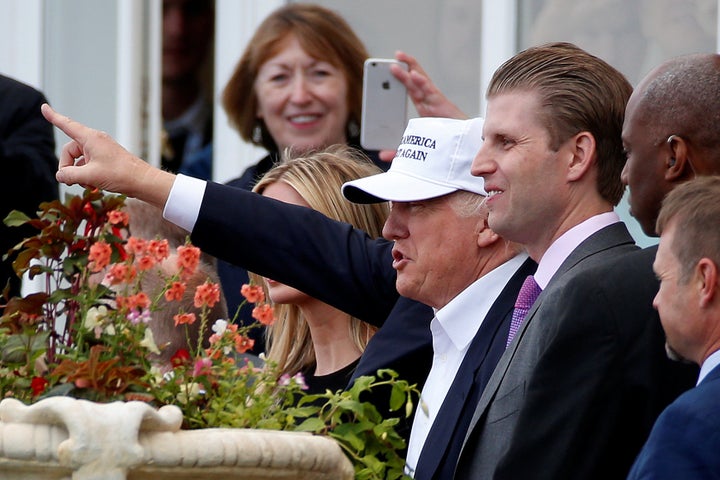 Trump with his son Eric Trump (R) after arriving at Turnberry Golf Course