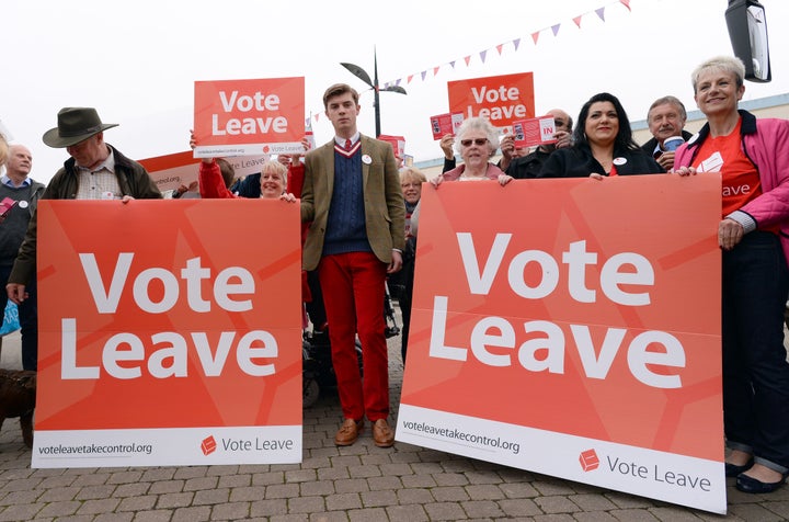 Vote Leave campaigners stand by the Vote Leave campaign bus in Truro, Cornwall