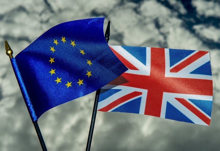 This photo illustration created on May 20, 2016 in Lille shows the flags of the European Union and the United Kingdom. On June 23, 2016 Great Britain will hold a referendum on whether or not the United Kingdom will remain within the European Union, often referred to as 'Brexit.' Group of Seven finance ministers on May 21 warned of the risks from a 'shock' to the world economy if Britain votes to leave the European Union next month. / AFP / PHILIPPE HUGUEN