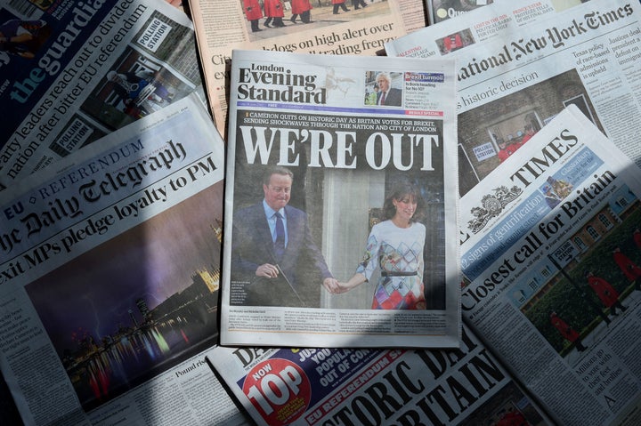 An arrangement of newspapers pictured in London on June 24, 2016, as an illustration, shows the front page of the London Evening Standard newpaper reporting the resignation of British Prime Minister David Cameron following the result of the UK's vote to leave the EU in the June 23 referendum.